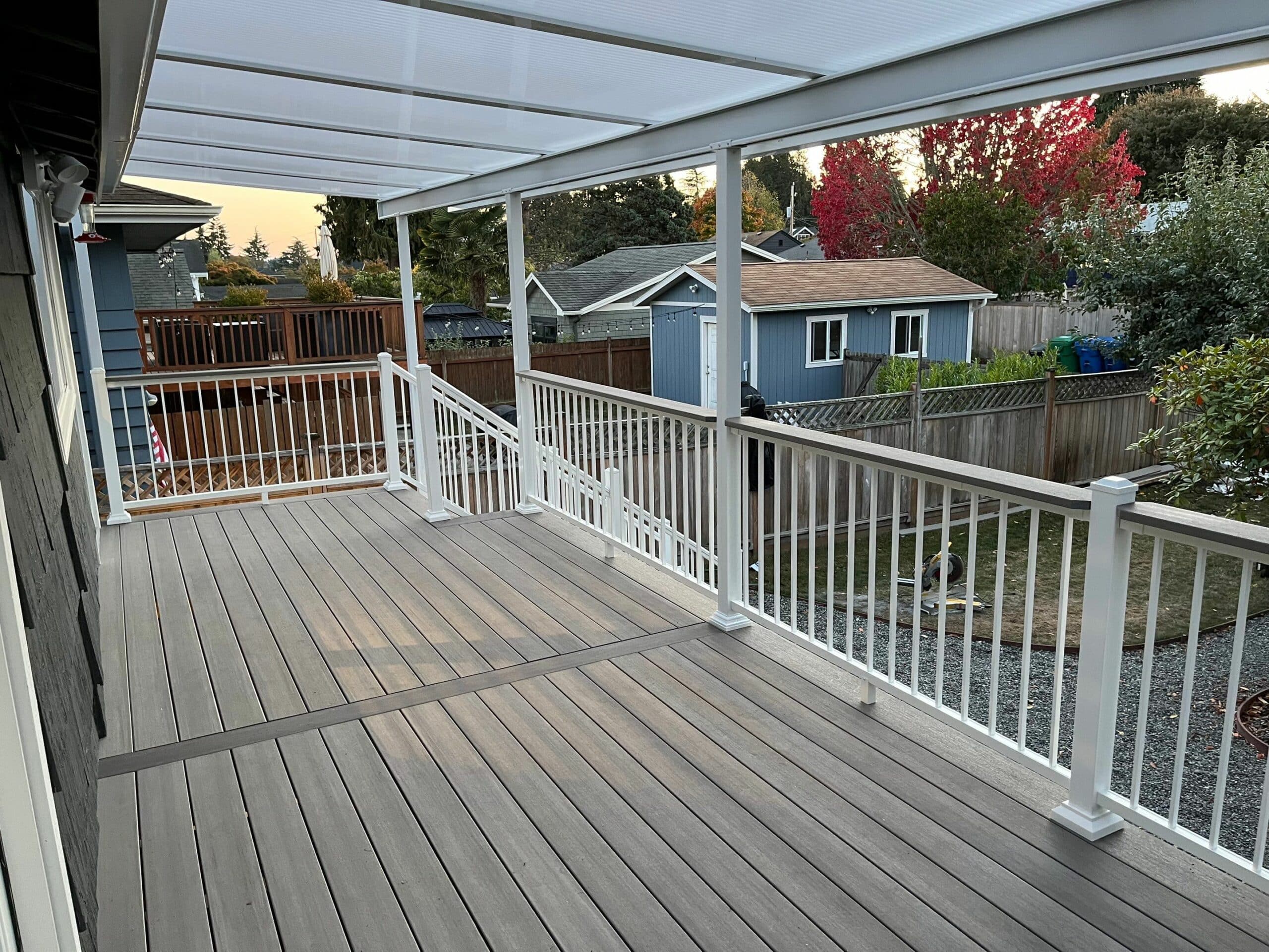 covered deck with white railing - Custom Deck Builder and contractor west seattle wa