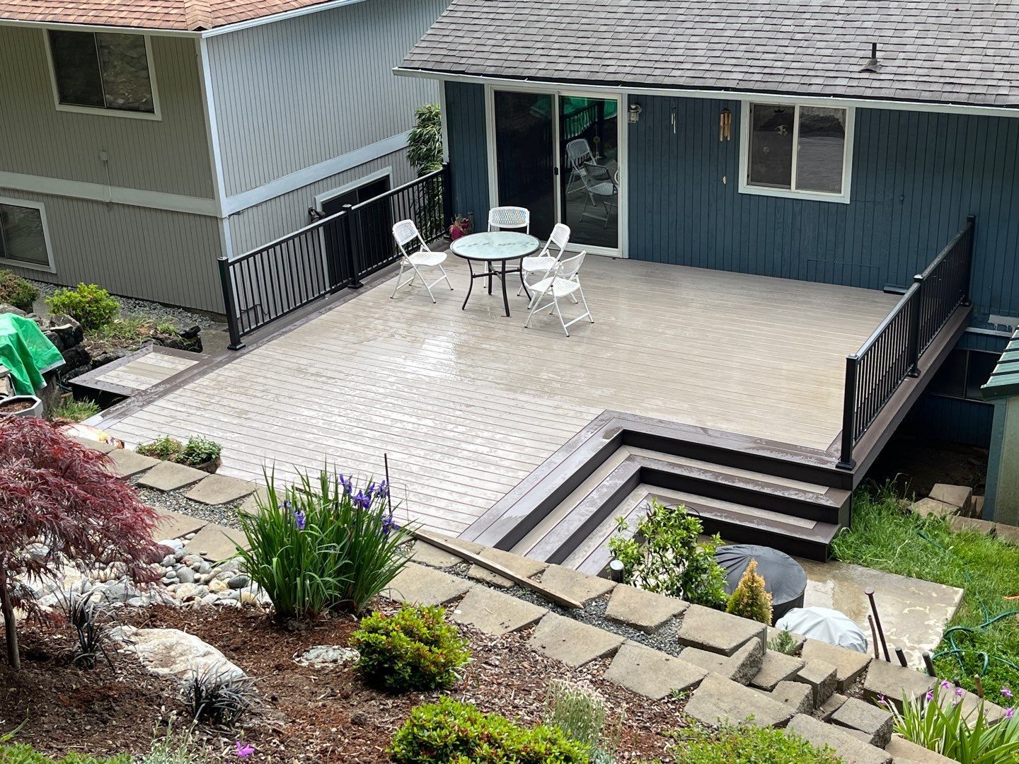 Platform deck with black railing and steps - Custom Composite Deck builder and contractor West Seattle WA