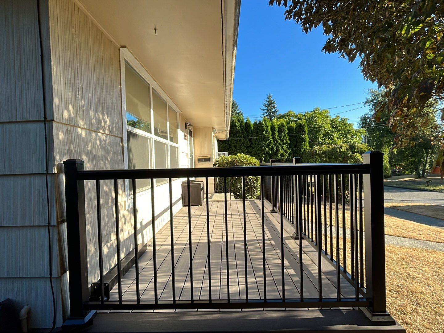 TimberTech deck with black metal railing - Custom Composite Deck builder and contractor West Seattle WA