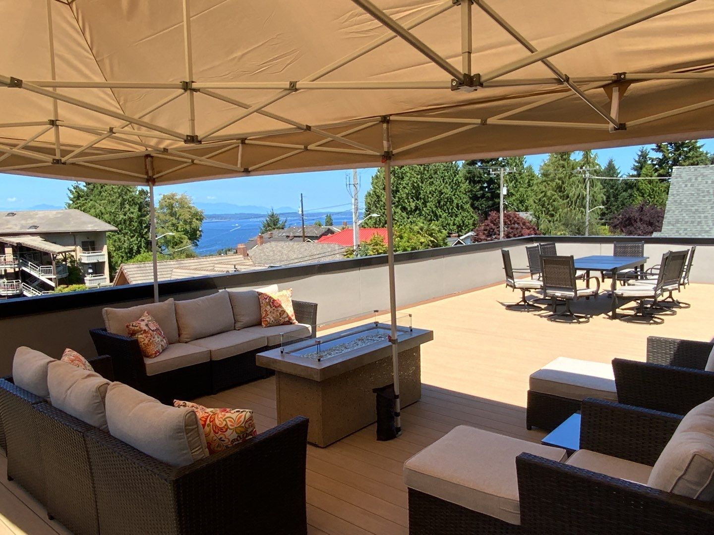 rooftop deck with outdoor furniture, fire table, and a shade structure - Custom Deck Builder and contractor west seattle wa