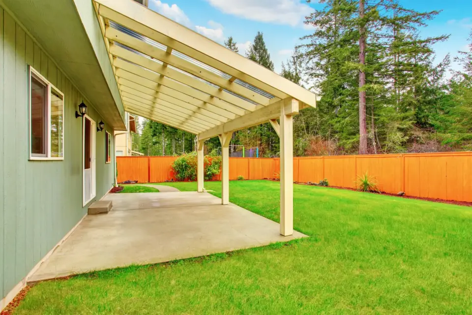 covered-backyard-porch-with-concrete-floor-and-privacy-wooden-wall-in-seattle-wa