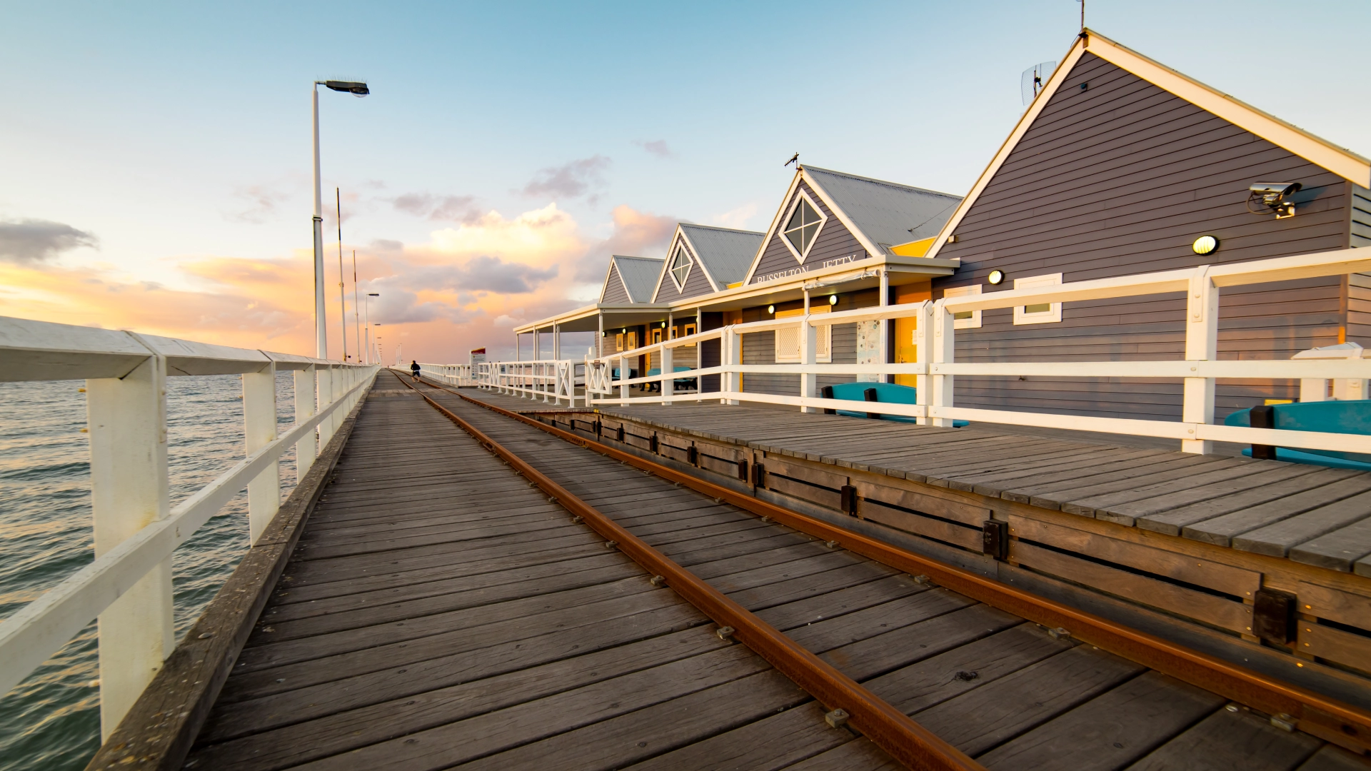 residential-dock-with-white-railing-and-modern-house-in-seattle-wa